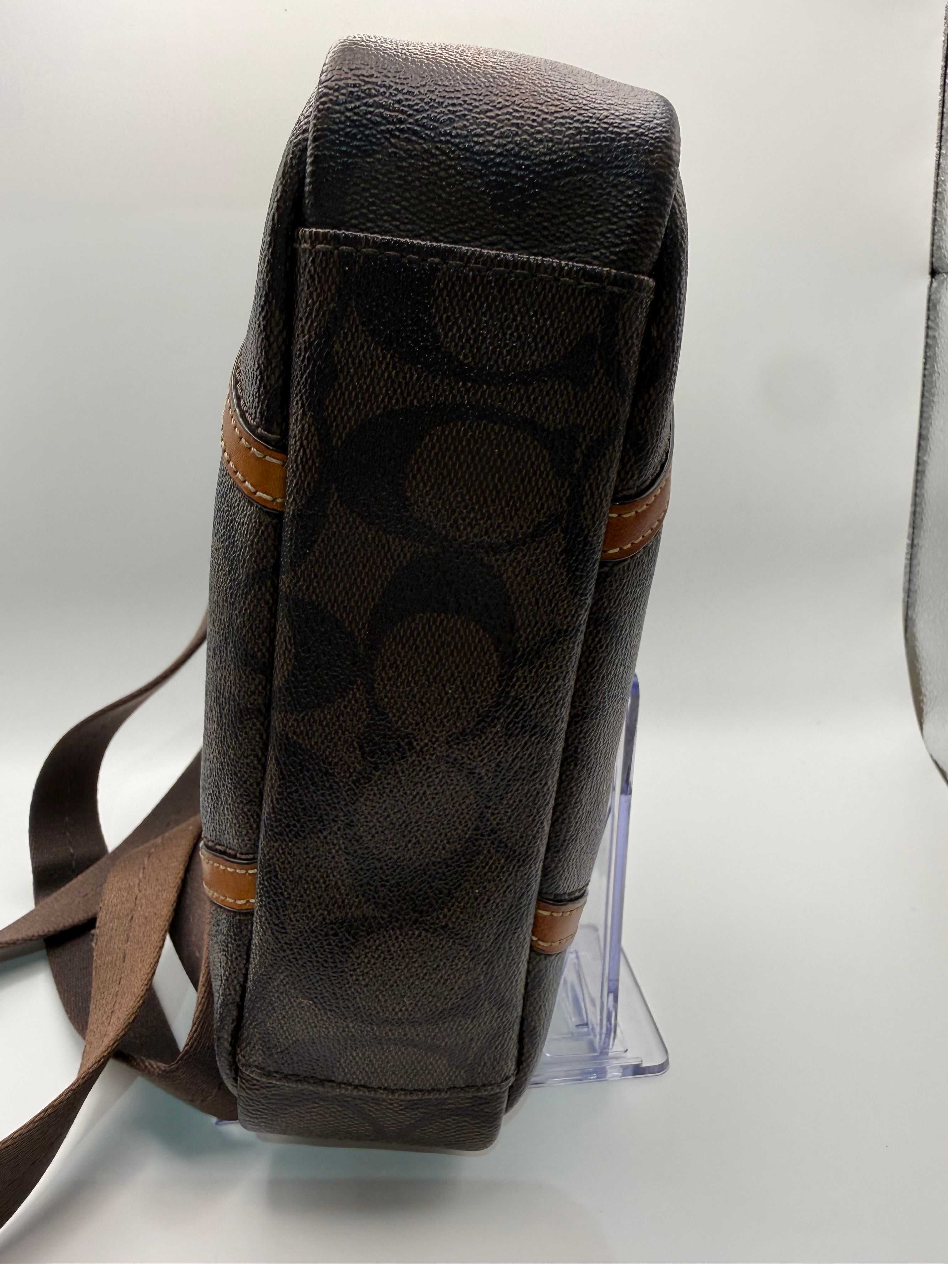 Coach Signature Canvas Crossbody Bag front view with Coach Est. 1941 medallion