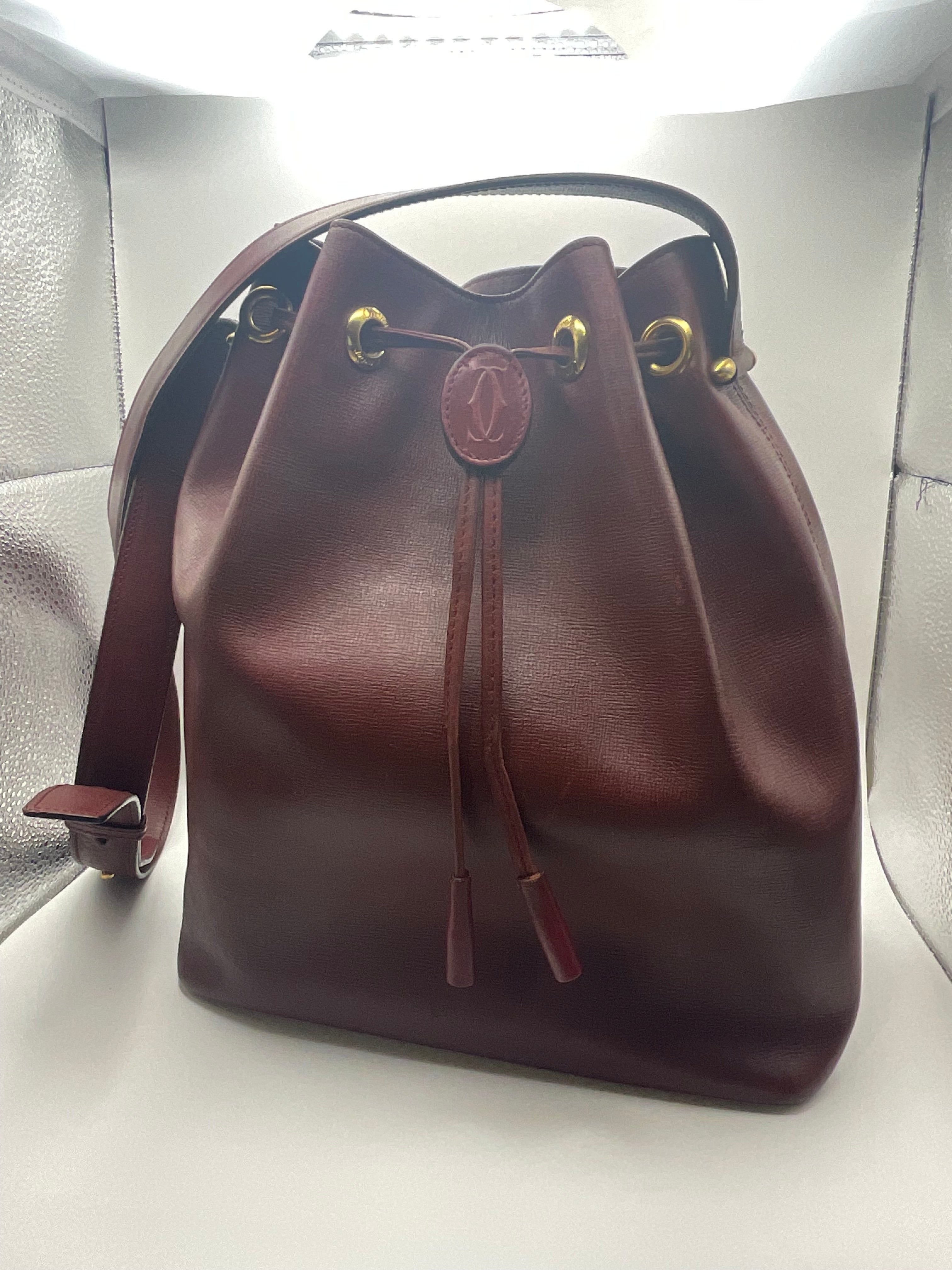 Cartier Must de Cartier Bordeaux Leather Drawstring Bucket Bag with COA