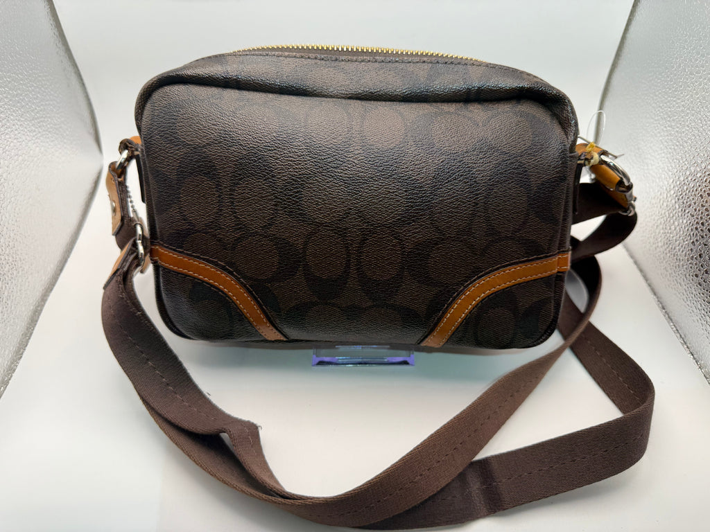 Coach Crossbody Bag interior showing tan lining and compartments