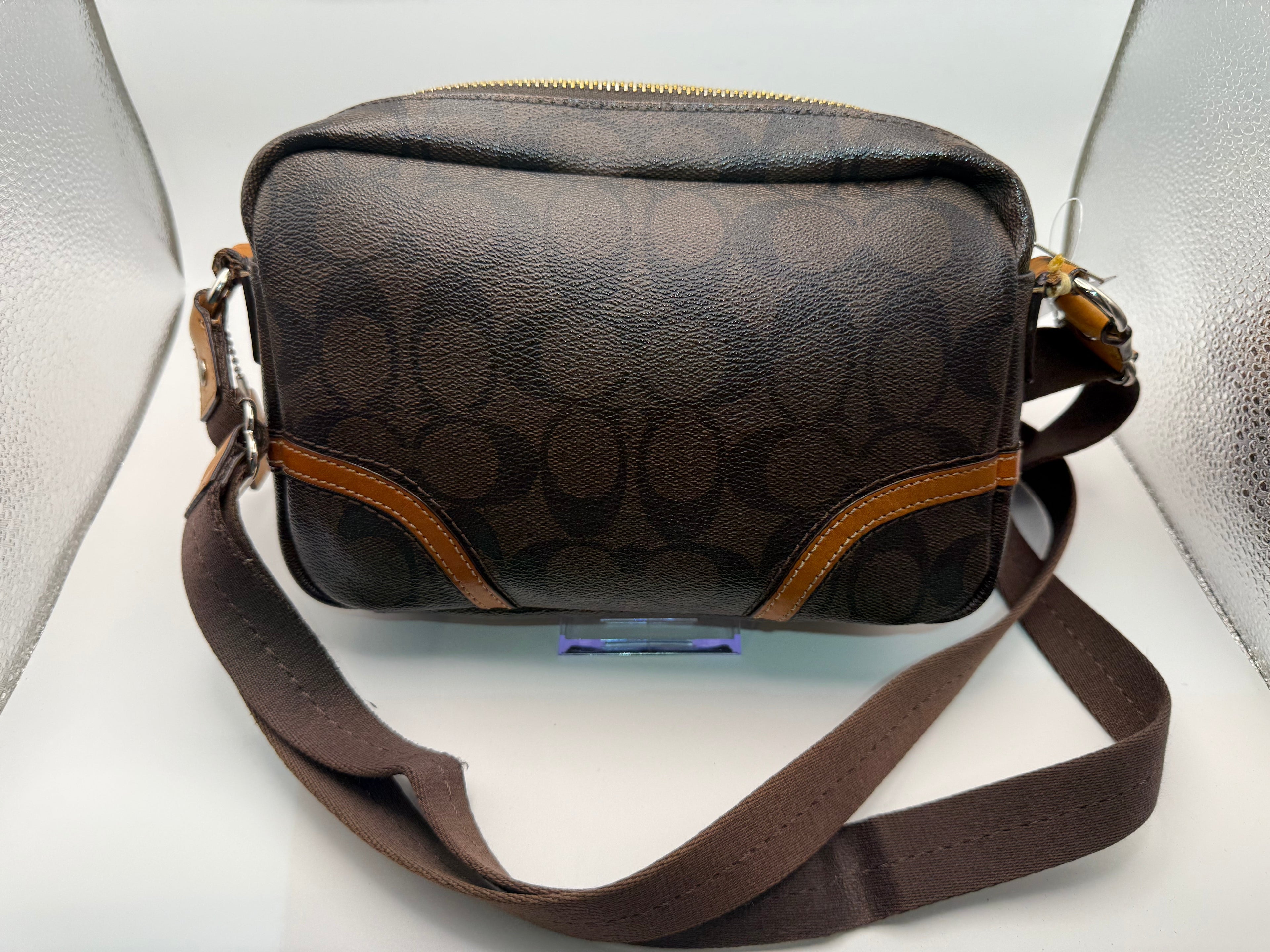 Coach Crossbody Bag interior showing tan lining and compartments